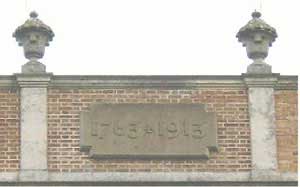 Peper Harow House date plaque on roof.